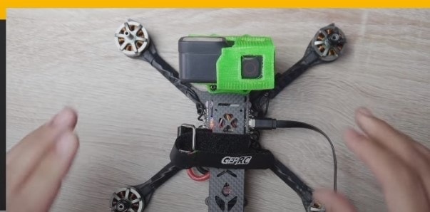 DJI drone connected to computer via USB-C cable for DJI Assistant 2