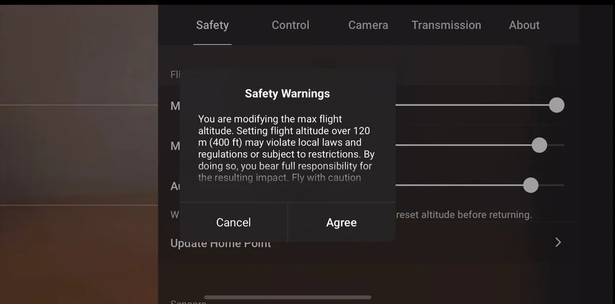 The DJI Fly Safety Warnings dialog stating that setting altitude over 120 m (400 ft) may violate local laws and the pilot bears full responsibility, with Cancel and Agree buttons