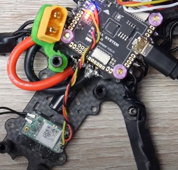 USB cable connecting a phone to a DJI RC-N1 controller