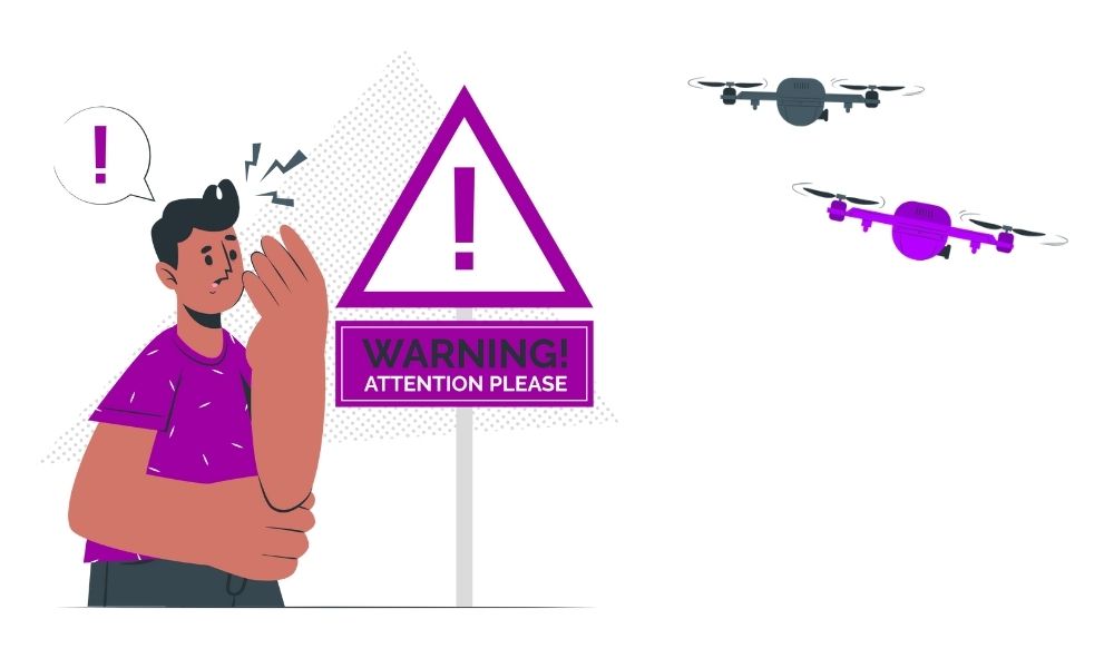 Professional drone photographer on location with controller and laptop for real estate shoot