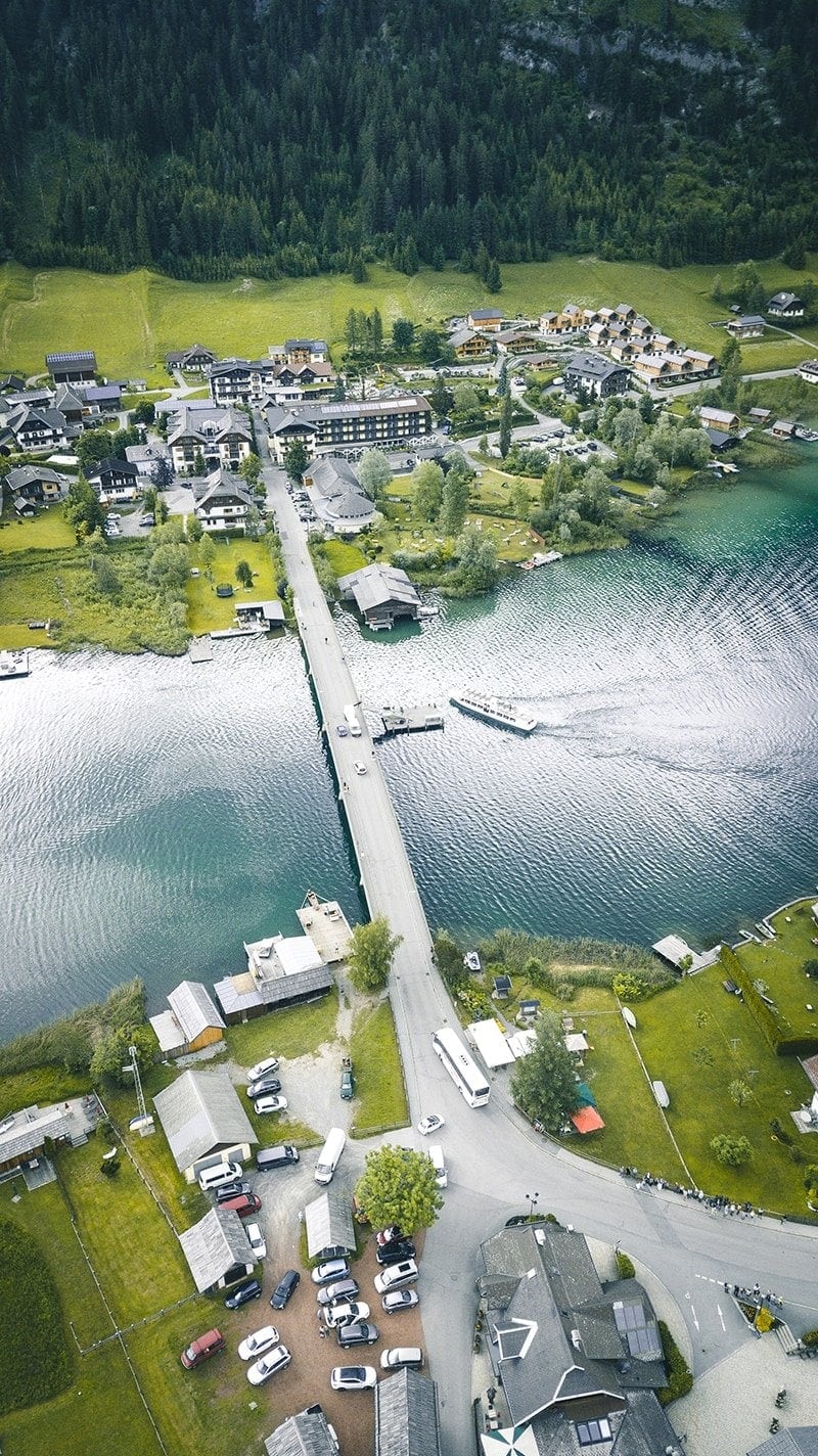 Aerial drone photograph of a lake at golden hour with soft warm light
