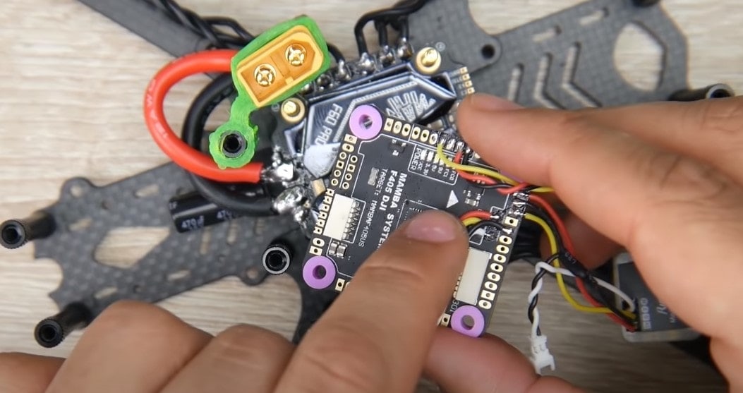 Flight controller orientation diagram showing motor positions in a quadcopter frame